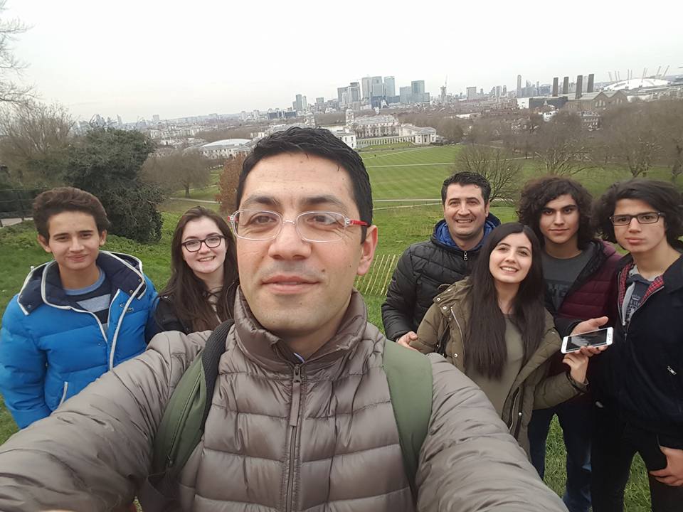 Group selfie at Greenwich Park with London skyline